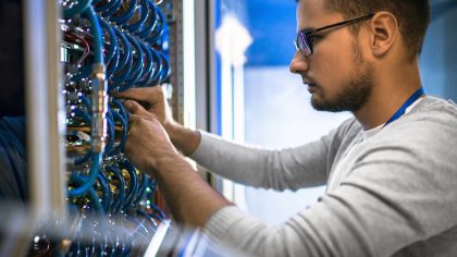 Technician Working on Networking Servers