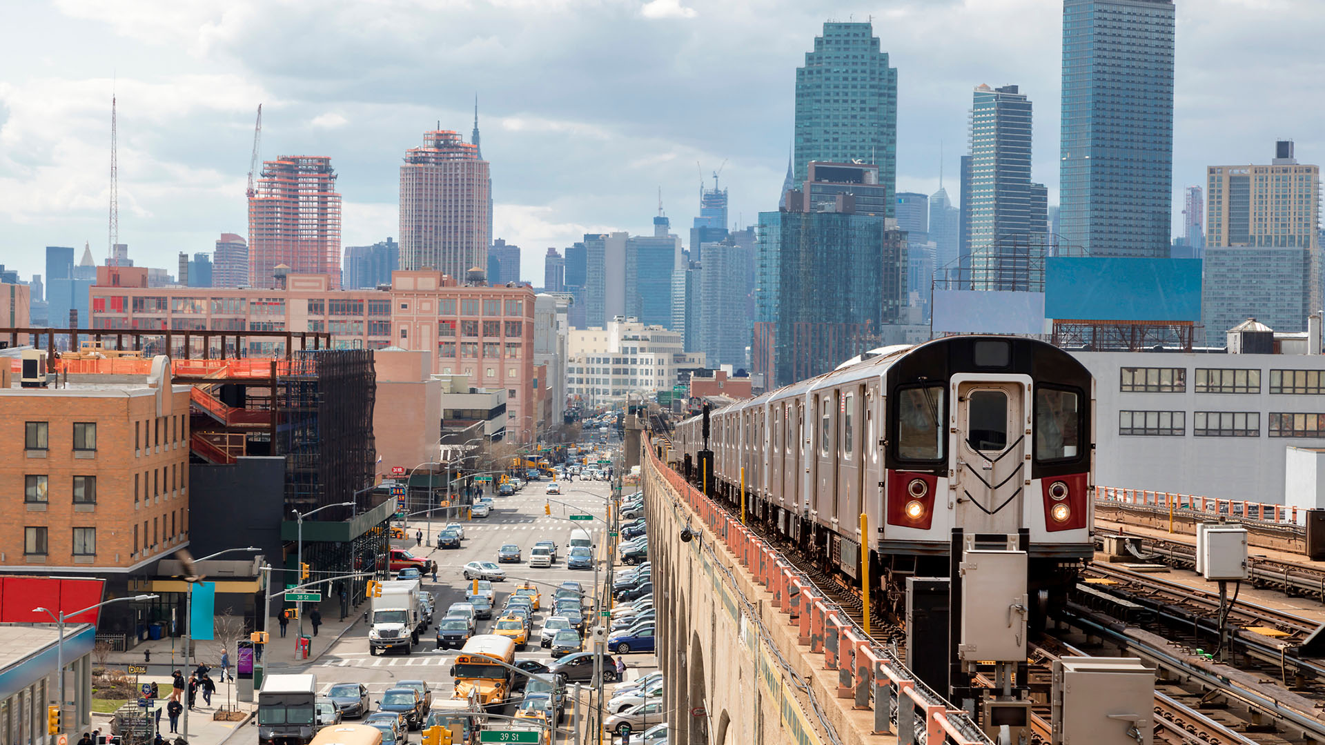 Subway Train Approaching Elevated Subway Station in Queens