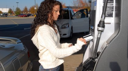 Woman Pumping Gas