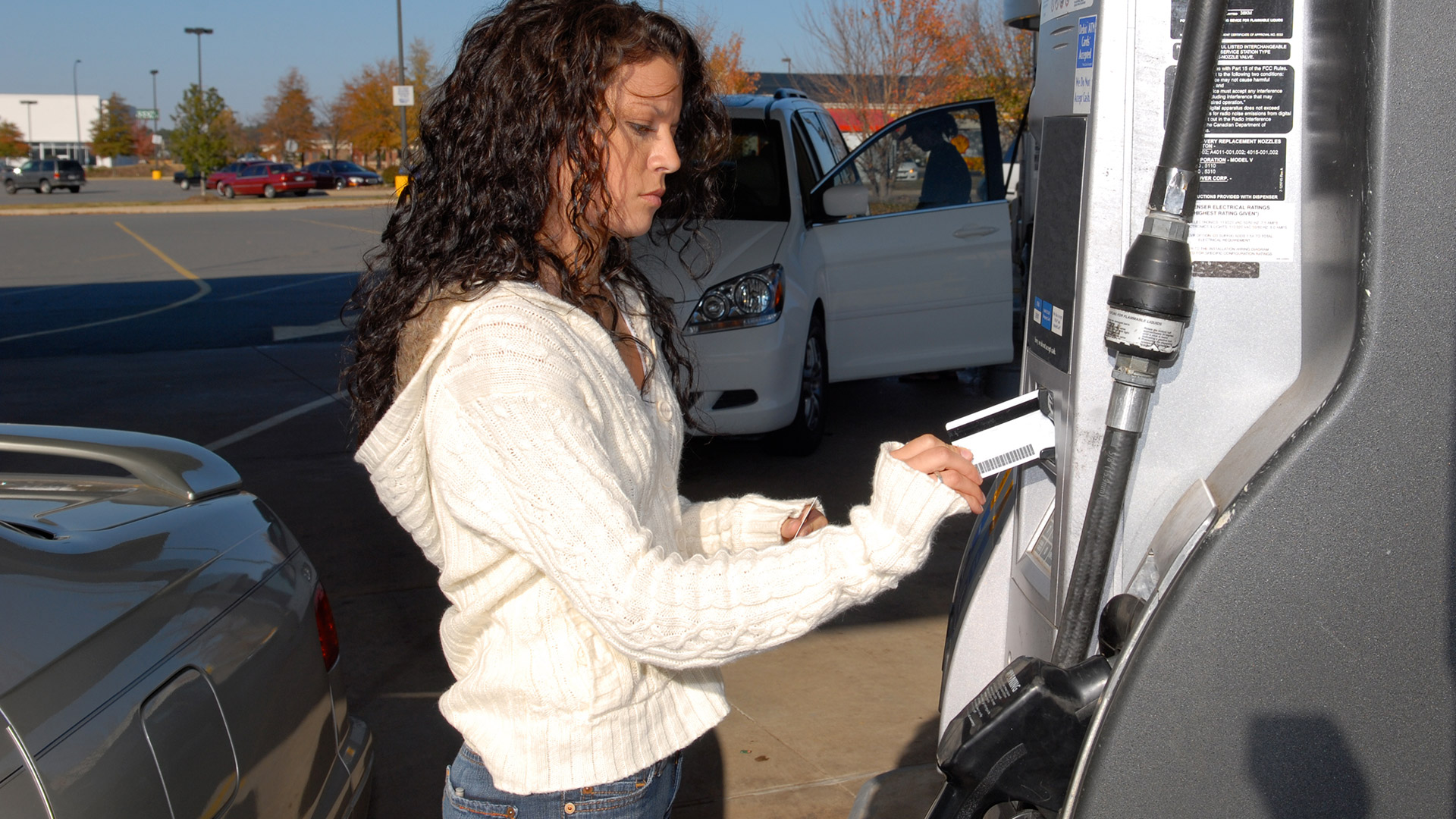 Woman Pumping Gas